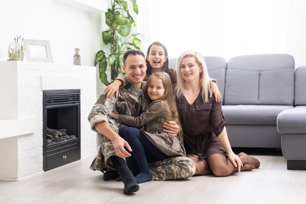 Family Greeting Military Father Home On Leave